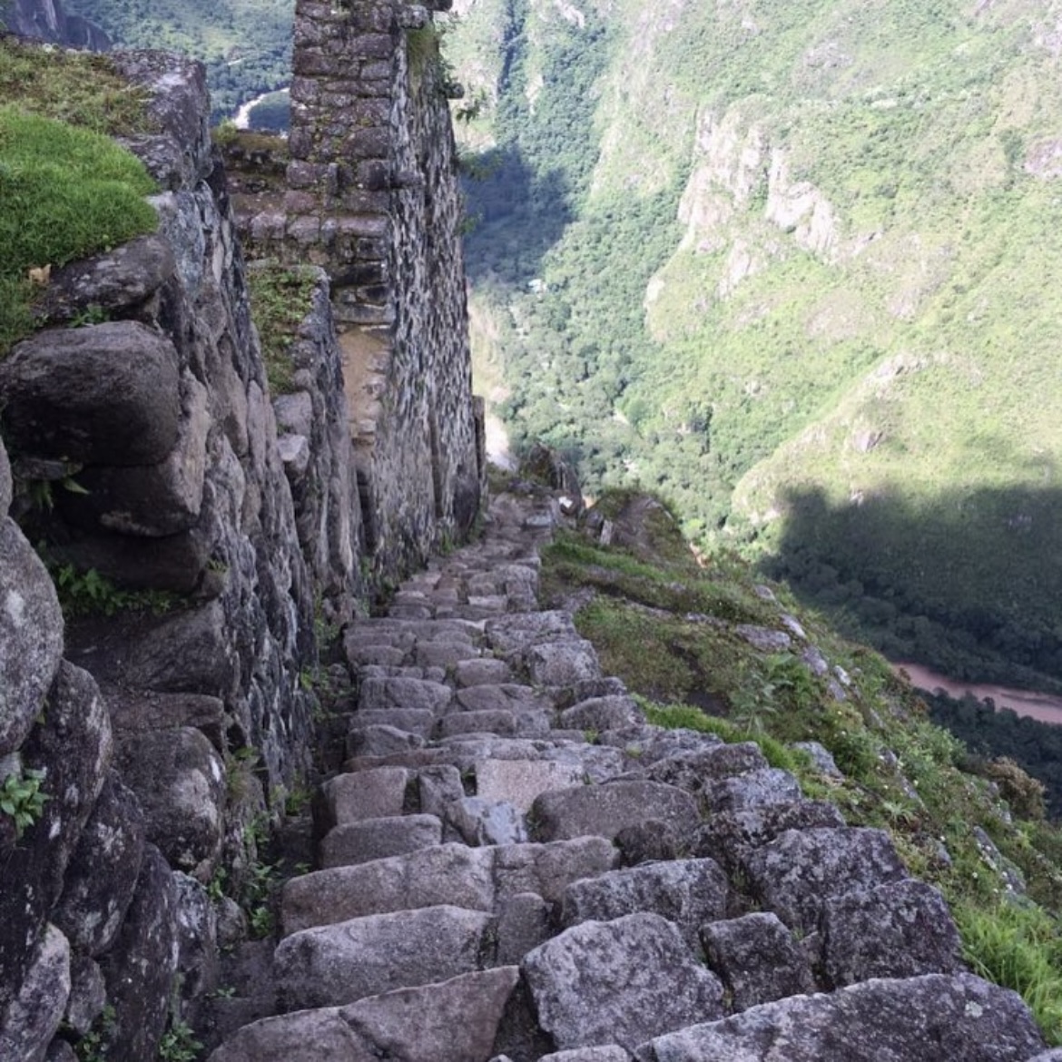 Hiking down the ancient Inca steps on Huayna Picchu in the Andes Mountains, Peru, 2014. Photo by Leah Gillis. Explore the breathtaking and challenging historical trail.