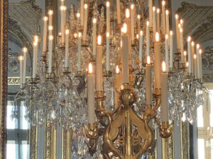 Luxurious interior decor and ornate chandelier in the historic Hotel de la Marine Paris, showcasing opulent design and elegant architecture.