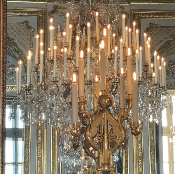 Luxurious interior decor and ornate chandelier in the historic Hotel de la Marine Paris, showcasing opulent design and elegant architecture.