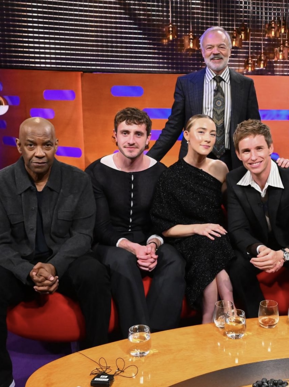 Saoirse Ronan and fellow guests on The Graham Norton Show, engaged in a lively discussion highlighting the astrology of the moment and addressing issues of men behaving badly, reflecting the ongoing conversation around empowerment and accountability.