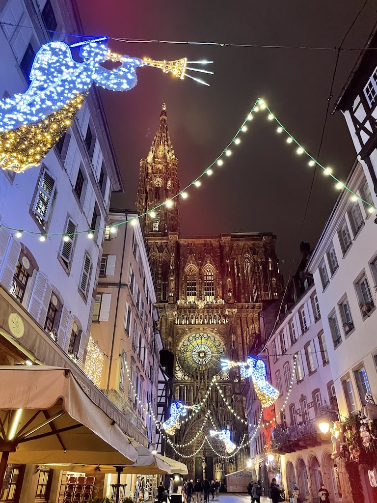 Beautifully illuminated streets of Strasbourg, France adorned with Christmas lights, creating a magical holiday ambiance.