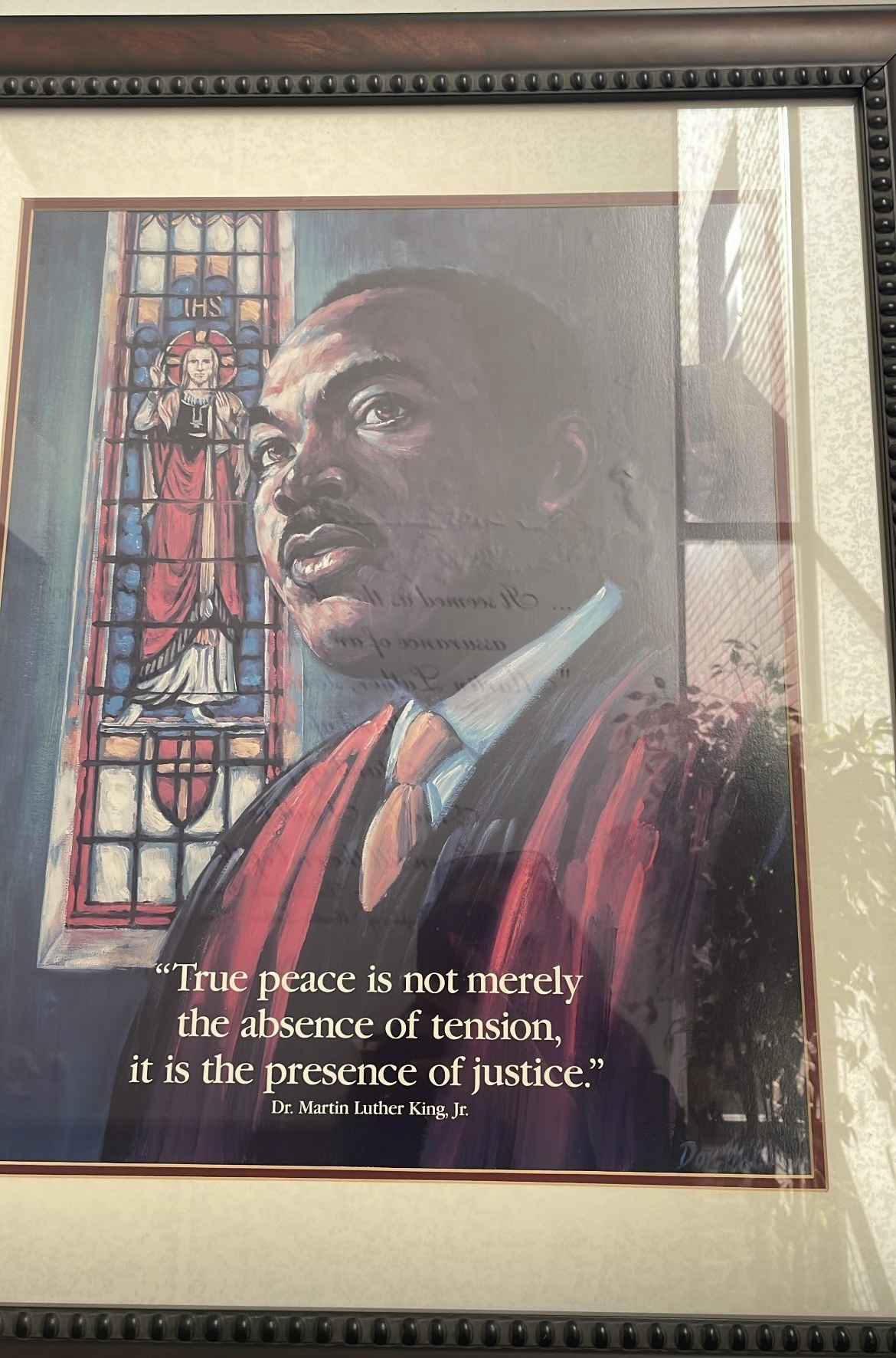 A poignant image of Martin Luther King Jr. at Ebenezer Baptist Church, where he passionately encourages us to strive for justice, equality, and a better future for all.