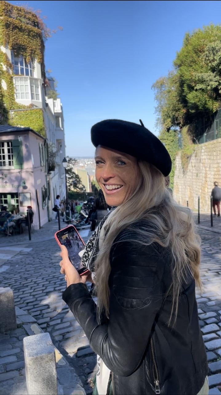 Ophélie waiting for the perfect shot in Montmartre at the Fête de Vendange, 2022.