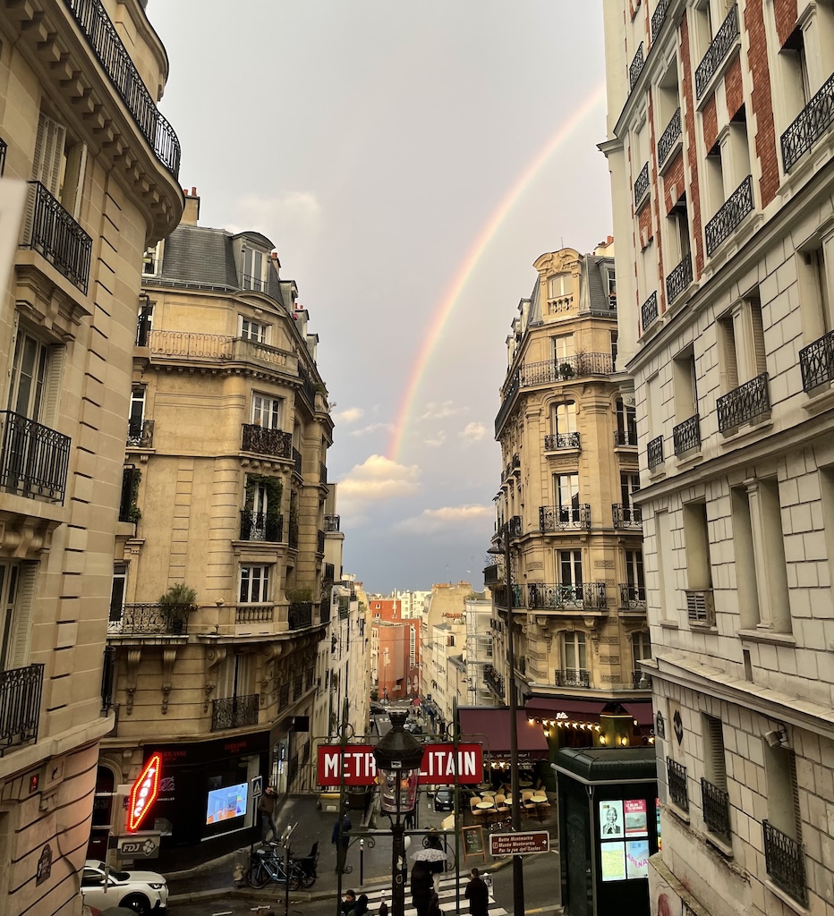 A rainbow above Montmartre. In French, it called an arc-en-ciel, or a bow (as in arrow) in the sky. I mean coming out of the cloud are you kidding me with this magic?!