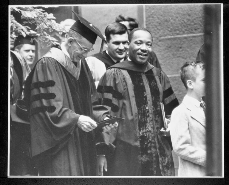 Dr. Martin Luther King Jr. walking with Wesleyan University President Butterfield in 1964.