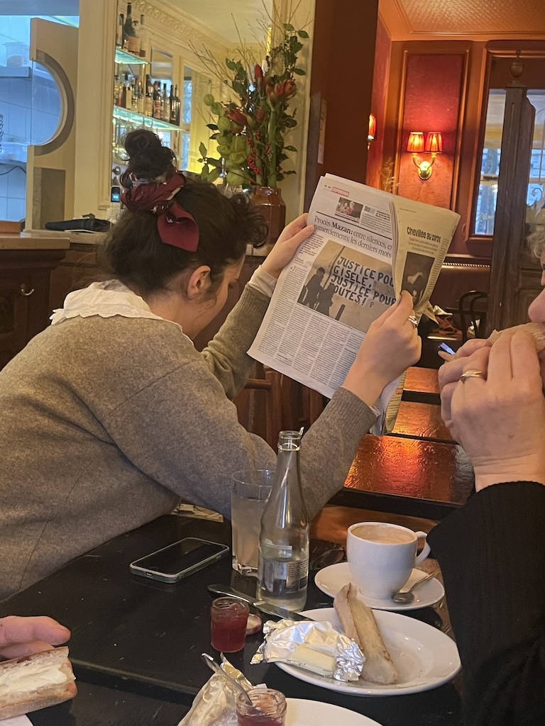 As I was writing this piece, a chic, charming French family came in beside me. I looked up at one point and saw the young woman reading. This is the moment in France.