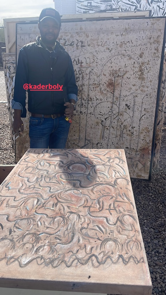 Contemporary African art sculpture by Burkina Faso and Atlanta-based artist Kader Boly displayed at the Tucson Gem Show, highlighting the event’s connection to global fine art and cultural expression.