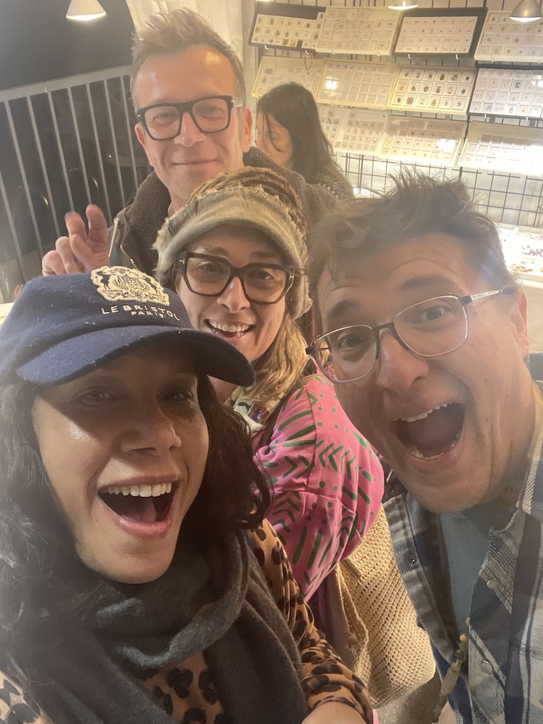 Leah Gillis with European gemstone buyers from Chasing Gems in Tucson, showing the global reach of the world’s largest gem and mineral event.