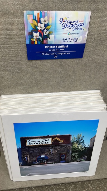 Outdoor art booth featuring original artworks at Atlanta Dogwood Festival in Piedmont Park