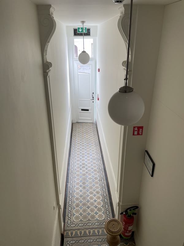 Historic Belgian details in this Antwerp Airbnb building, reminding that beauty is in the small details and everywhere. (Look at those moldings up high!)