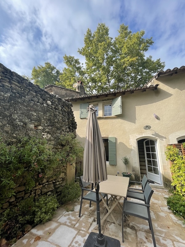Provence countryside home with lush garden, stone exterior, and classic French architecture