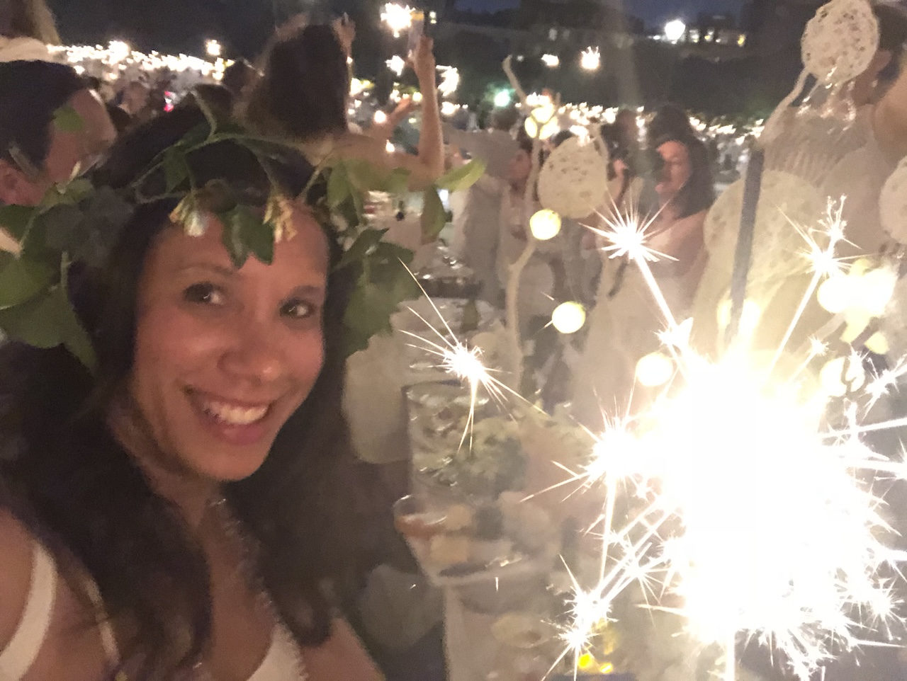 Leah Gillis enjoying Dîner en Blanc Paris 2018 among friends, flowers, champagne, and elegant white table settings near Invalides. As a celebration of culture, conversation, and community, the event perfectly embodies the themes of Gemini Season and the joy of meaningful connection. Photo by Leah Gillis, The Diamond Is You.