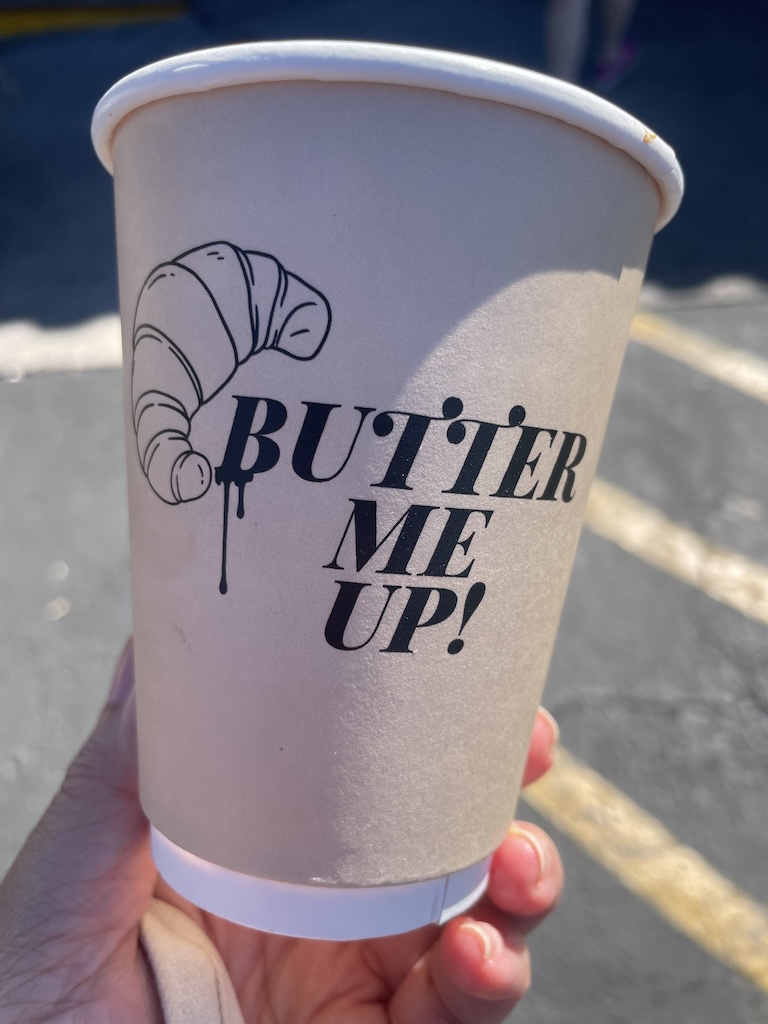 Clever cup at JL Patisserie Phoenix Arizona reading Butter Up charming independent French patisserie near Phoenix airport