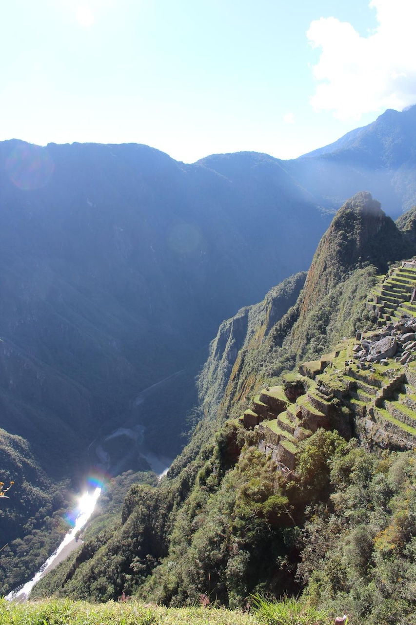 Machu Picchu and the Andes mountains in Peru with water below the dramatic mountain landscape